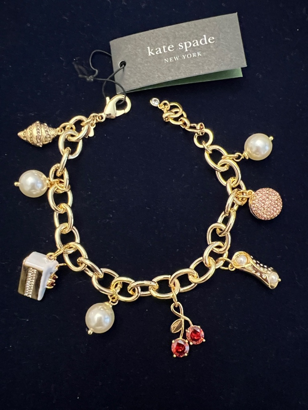 kate spade gold-tone charm bracelet with pearls and red cherry charms